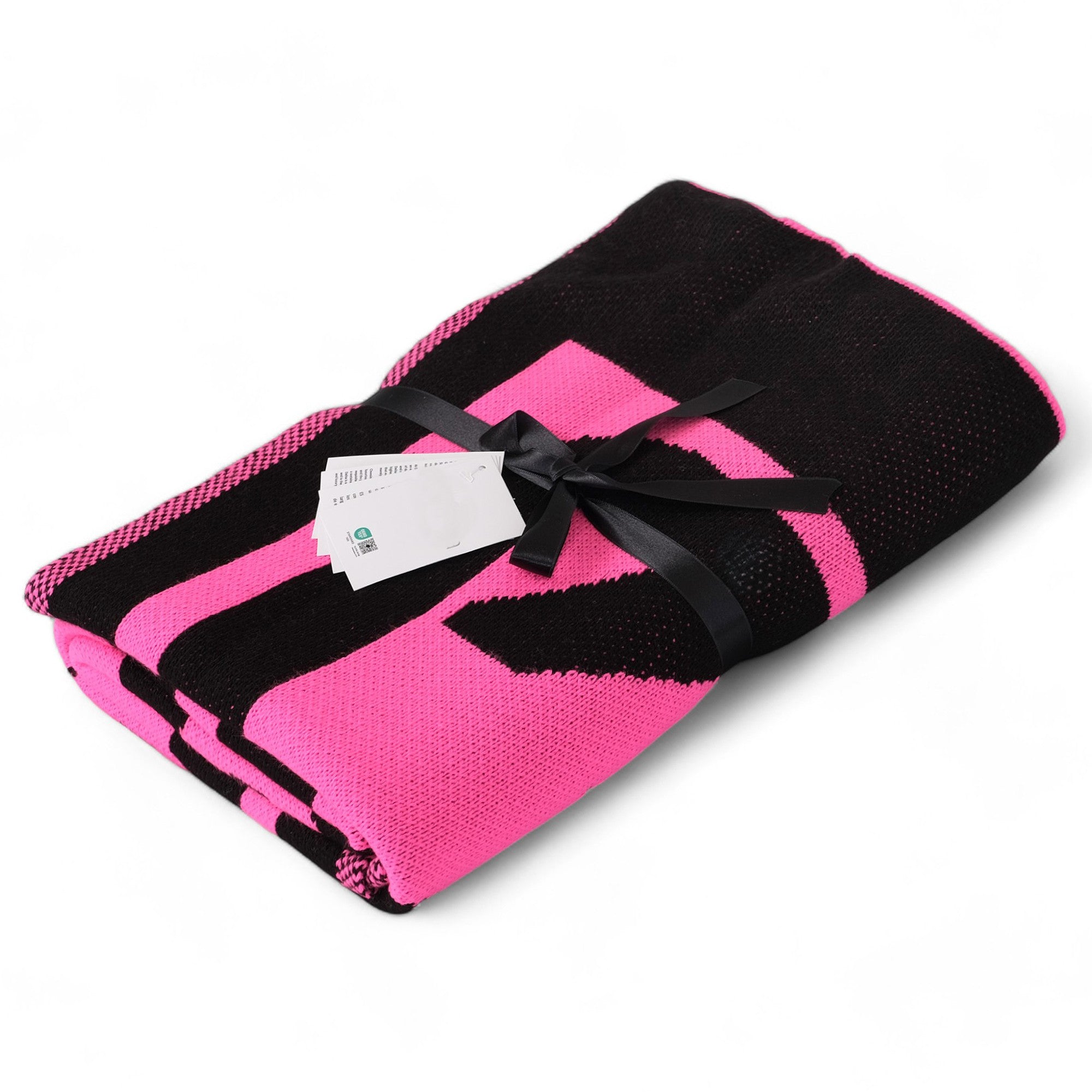 Pink and black striped blanket with a black ribbon on a white background