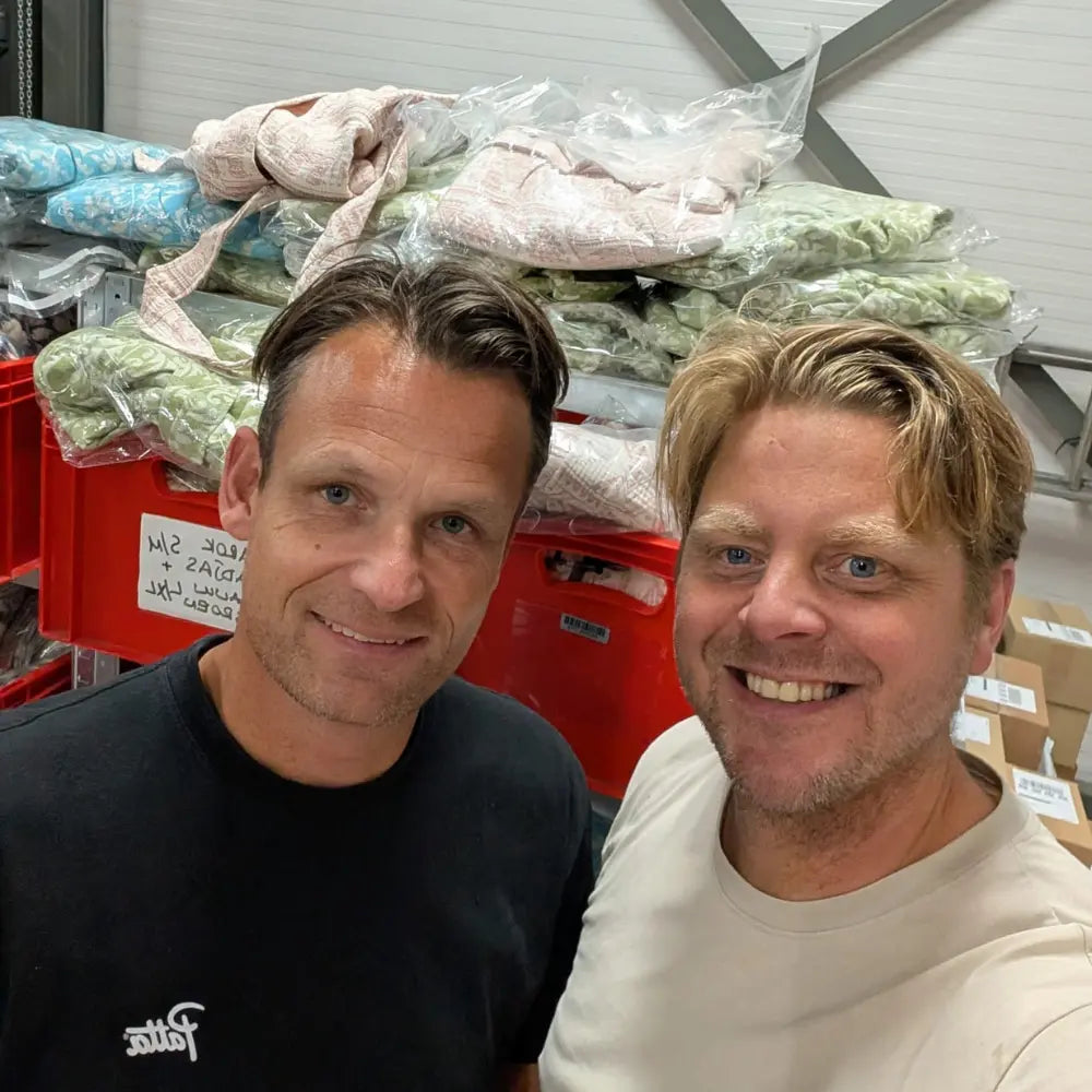Olaf and Folkert taking a selfie inside Trimita’s Frobenstraat 5 Rotterdam warehouse, with Trimita products in the background.
