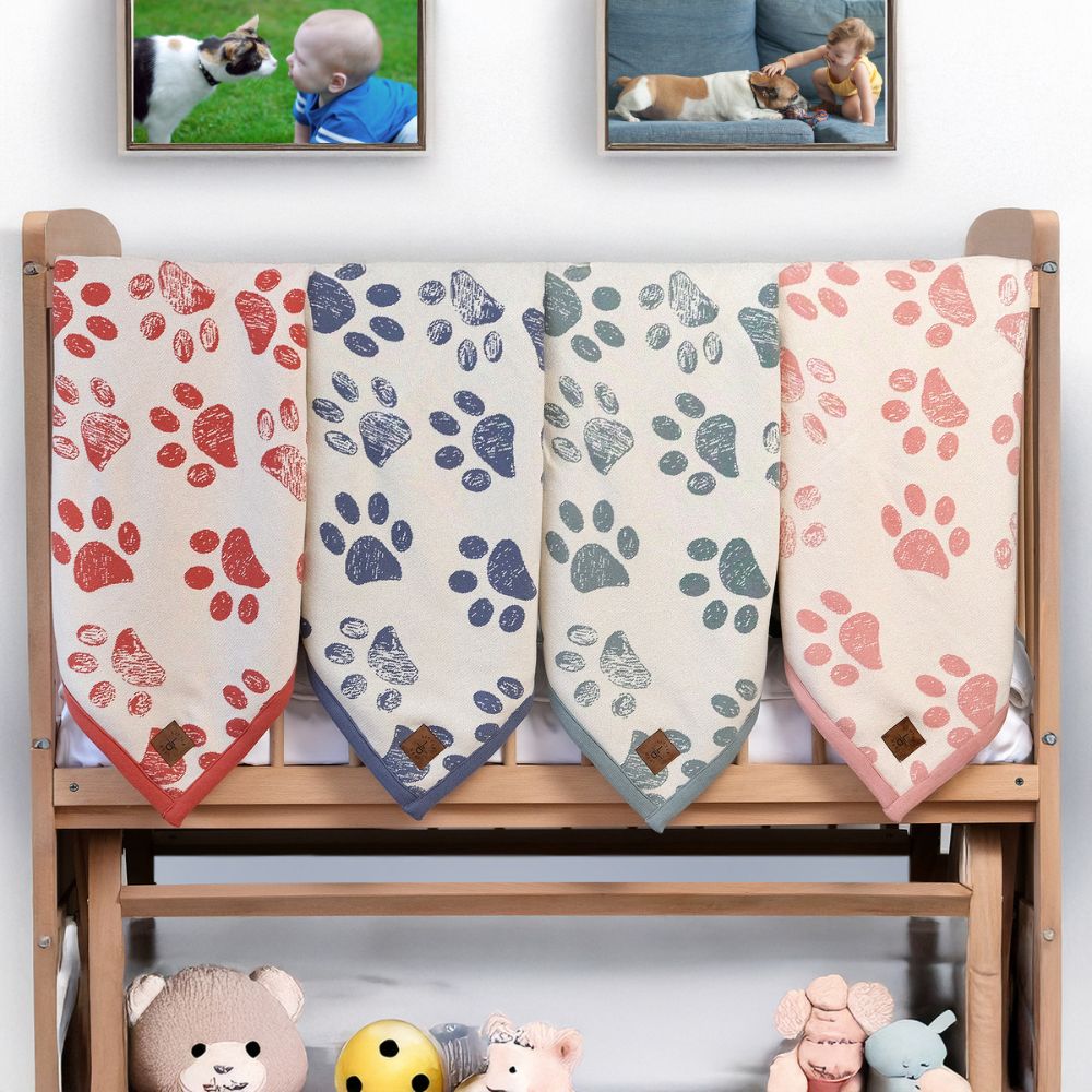 Organic Cotton Baby Blankets in various colors. Soft, breathable, with paw print design. Perfect for babies and toddlers.
