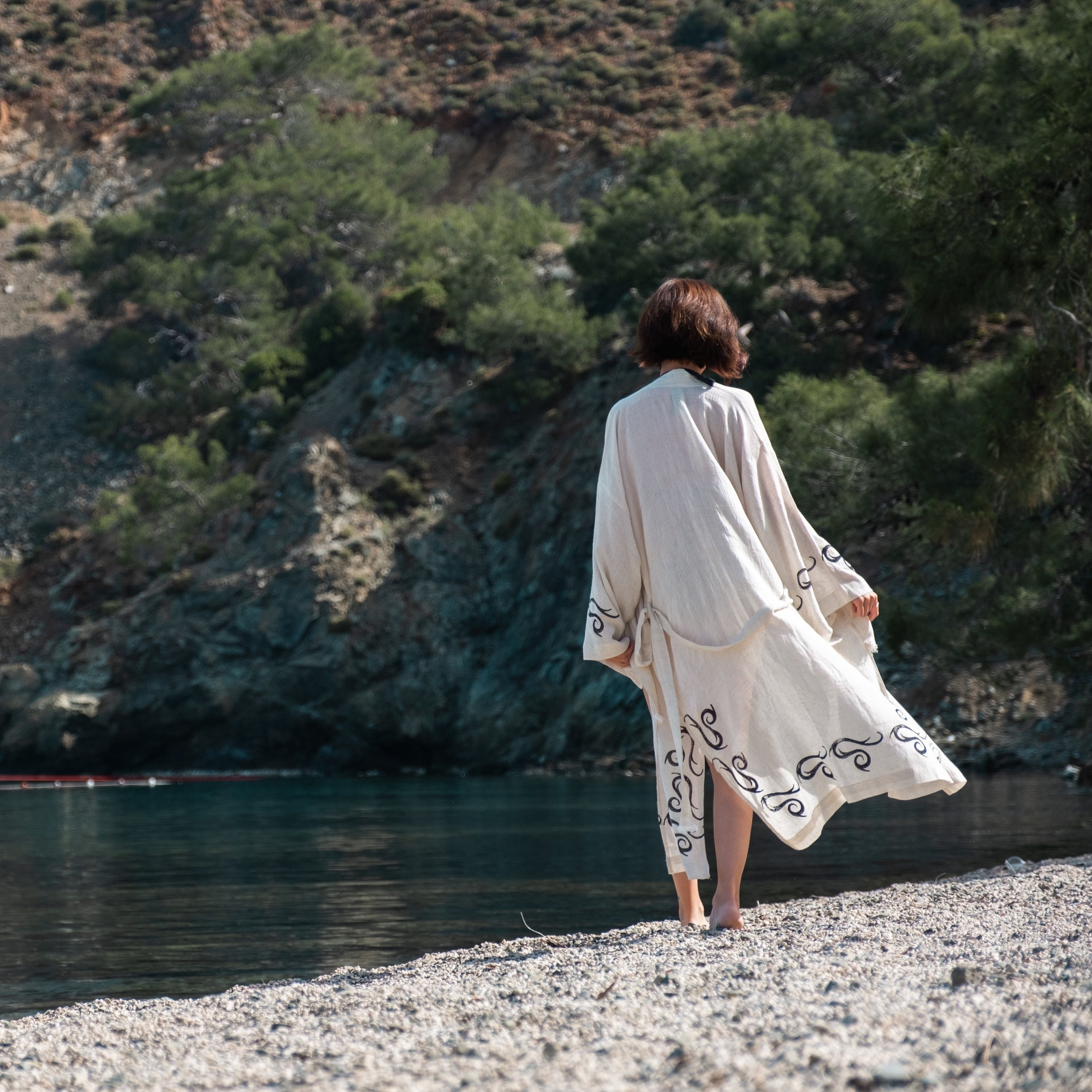 Handcrafted kimono made from a 70% linen, 30% cotton blend, dyed with natural root dyes and printed with linden tree blocks. The garment is one-size-fits-all, fitting sizes small through large.