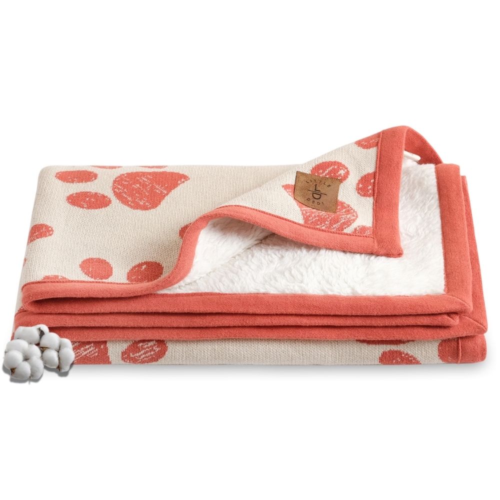 Organic Cotton Baby Blanket in Amberglow: Soft, breathable, with paw print design. Perfect for cozy moments with babies.