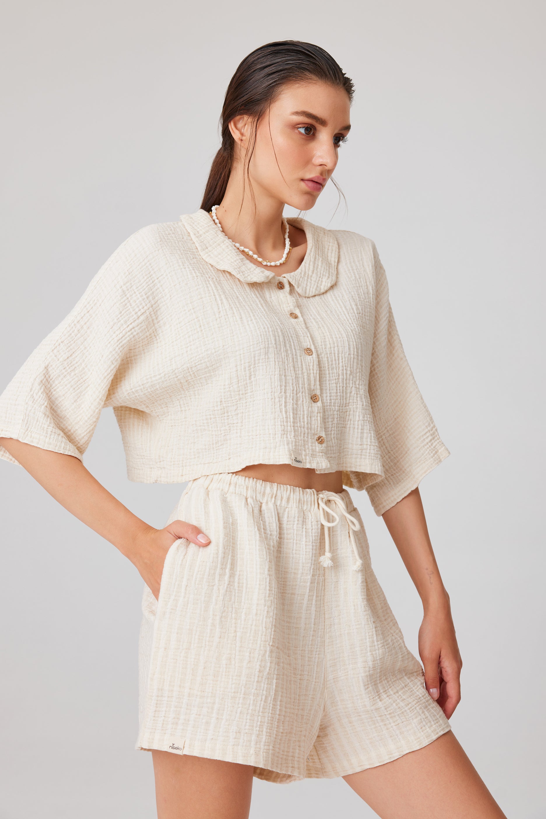 Cream lounge set with short-sleeved crop top and high-waisted shorts