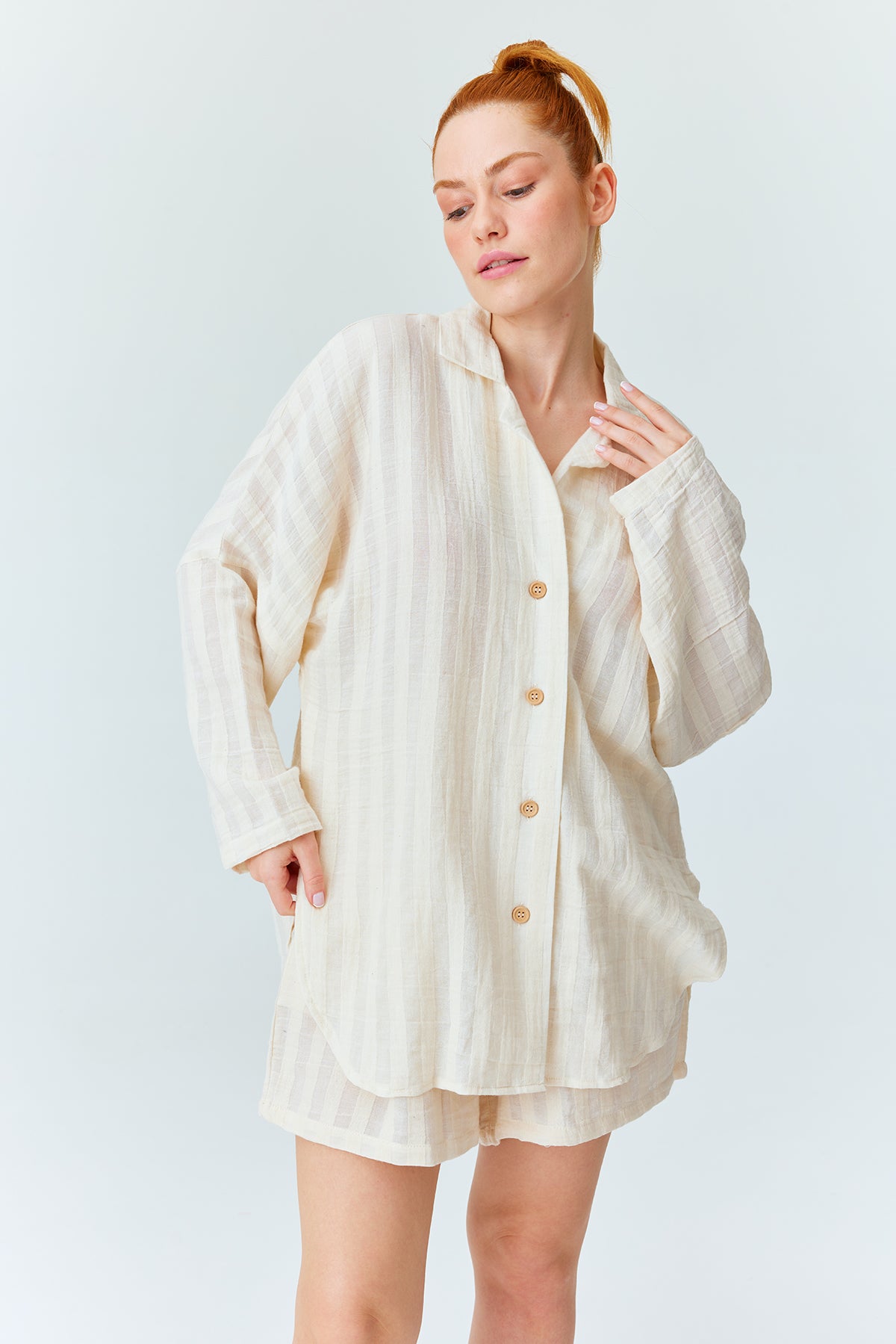 beautiful redhead woman with stripped shirt