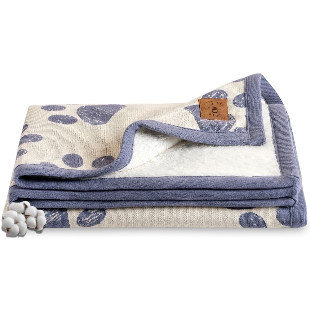 Organic Cotton Baby Blanket: Soft, breathable, with paw print design. Folded, showcasing sherpa backing and premium quality.