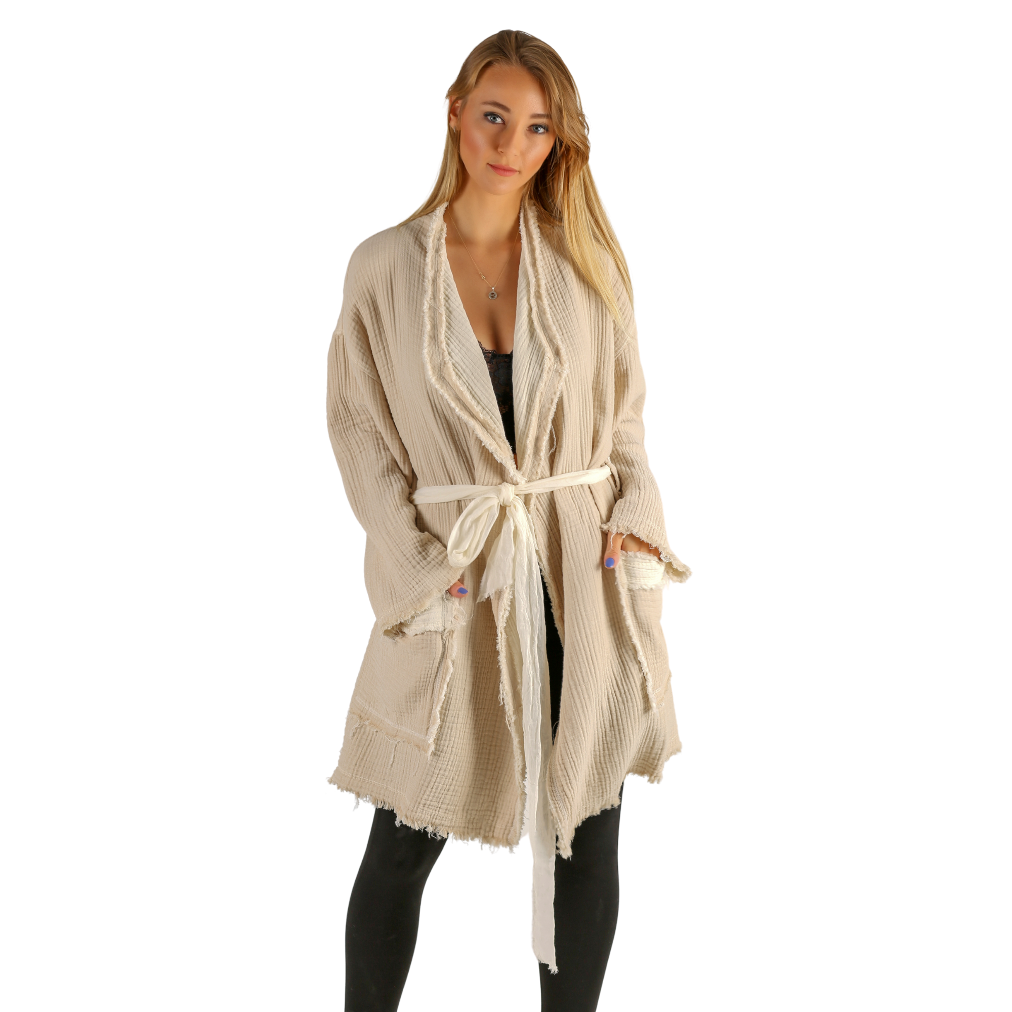 A girl wears natural color muslin jacket, open front, long sleeves,