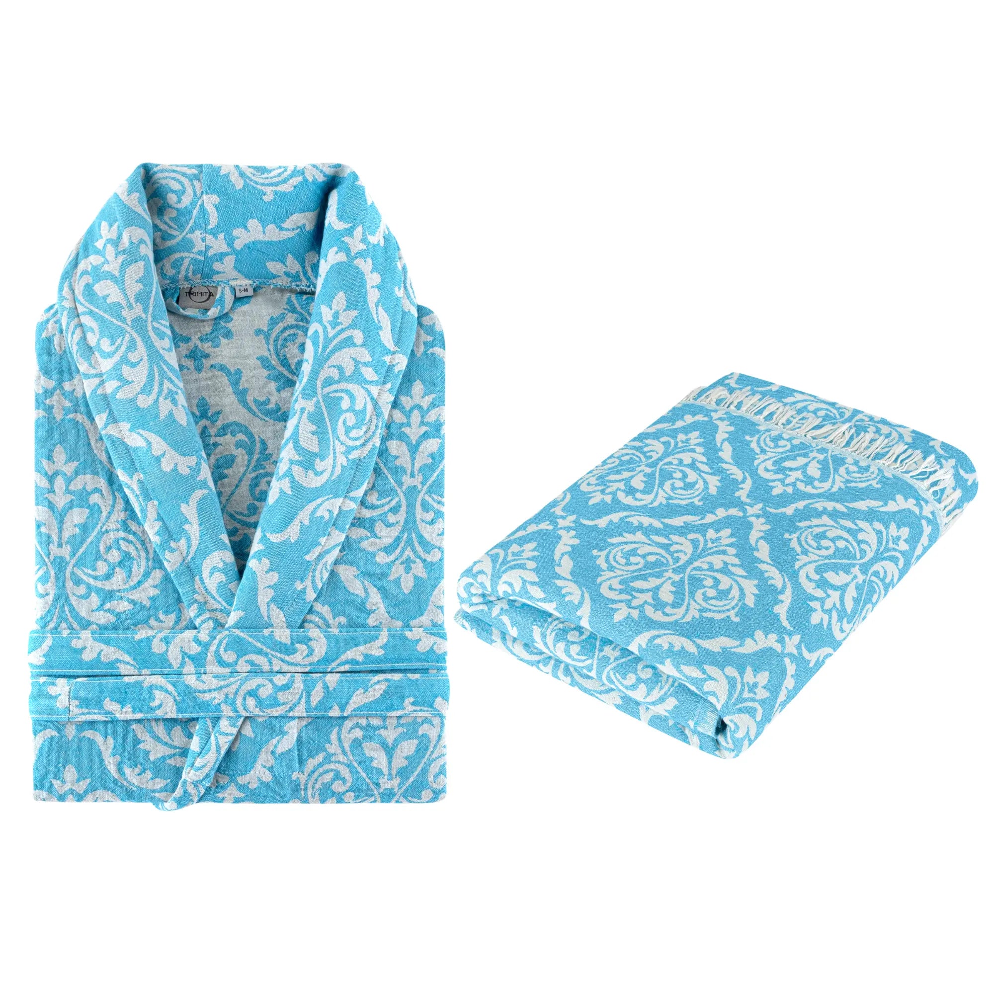Folded blue baroque pattern bathrobe with matching fringed towel, premium gift set by Trimita Home.