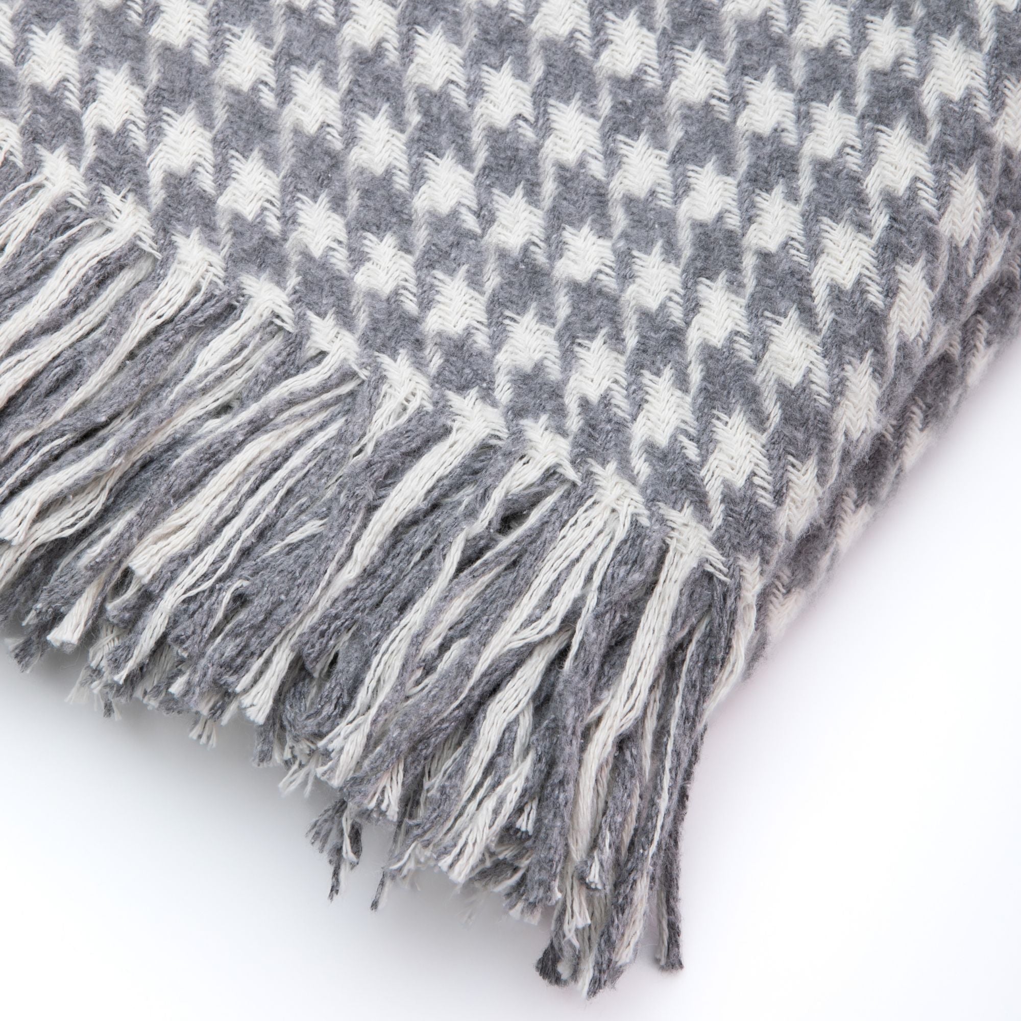 Trimita | Close-up view of the Grey Houndstooth Luxury Throw Blanket on a white background, highlighting the intricate weaving details and texture.
