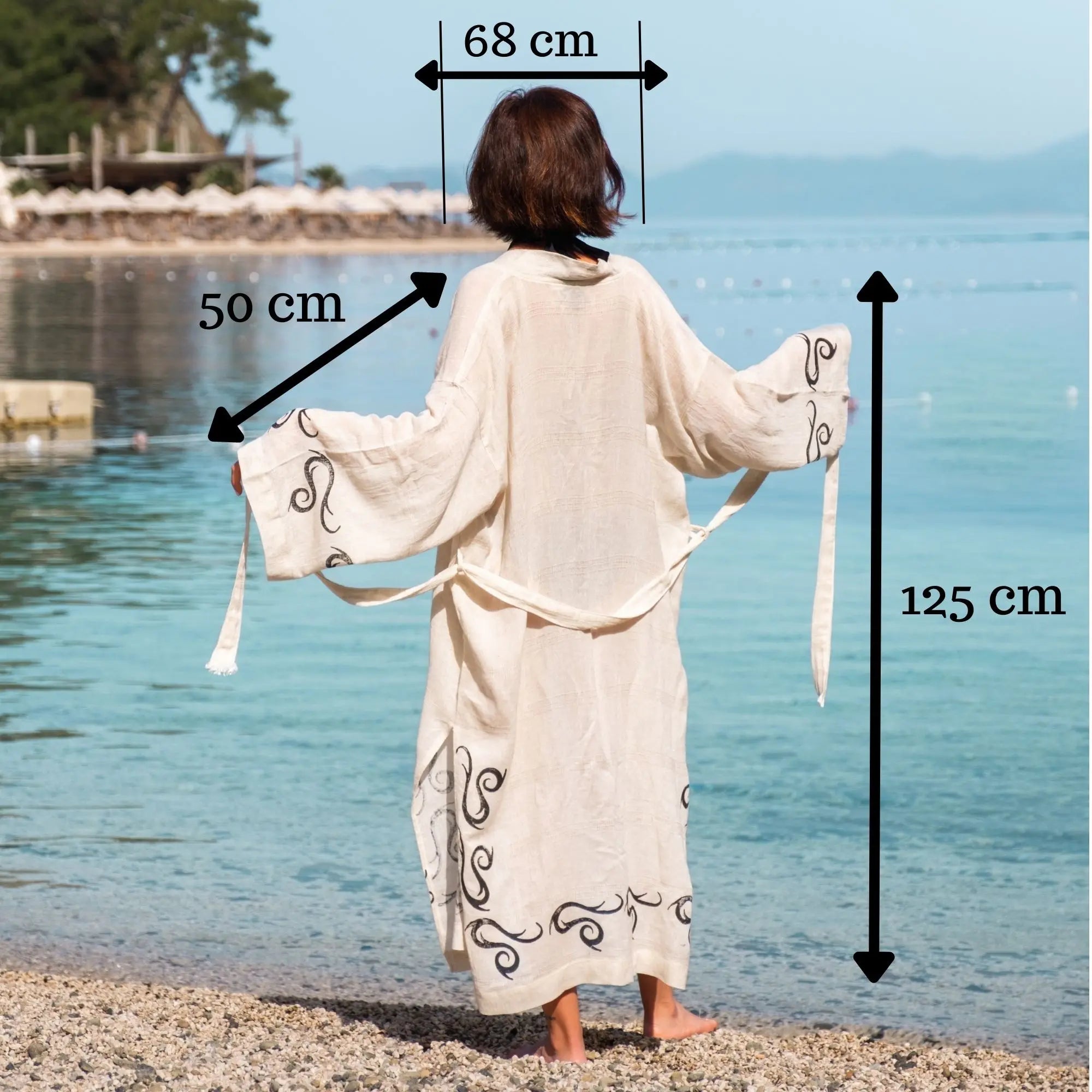 Handcrafted kimono made from a 70% linen, 30% cotton blend, dyed with natural root dyes and printed with linden tree blocks. The garment is one-size-fits-all, fitting sizes small through large.
