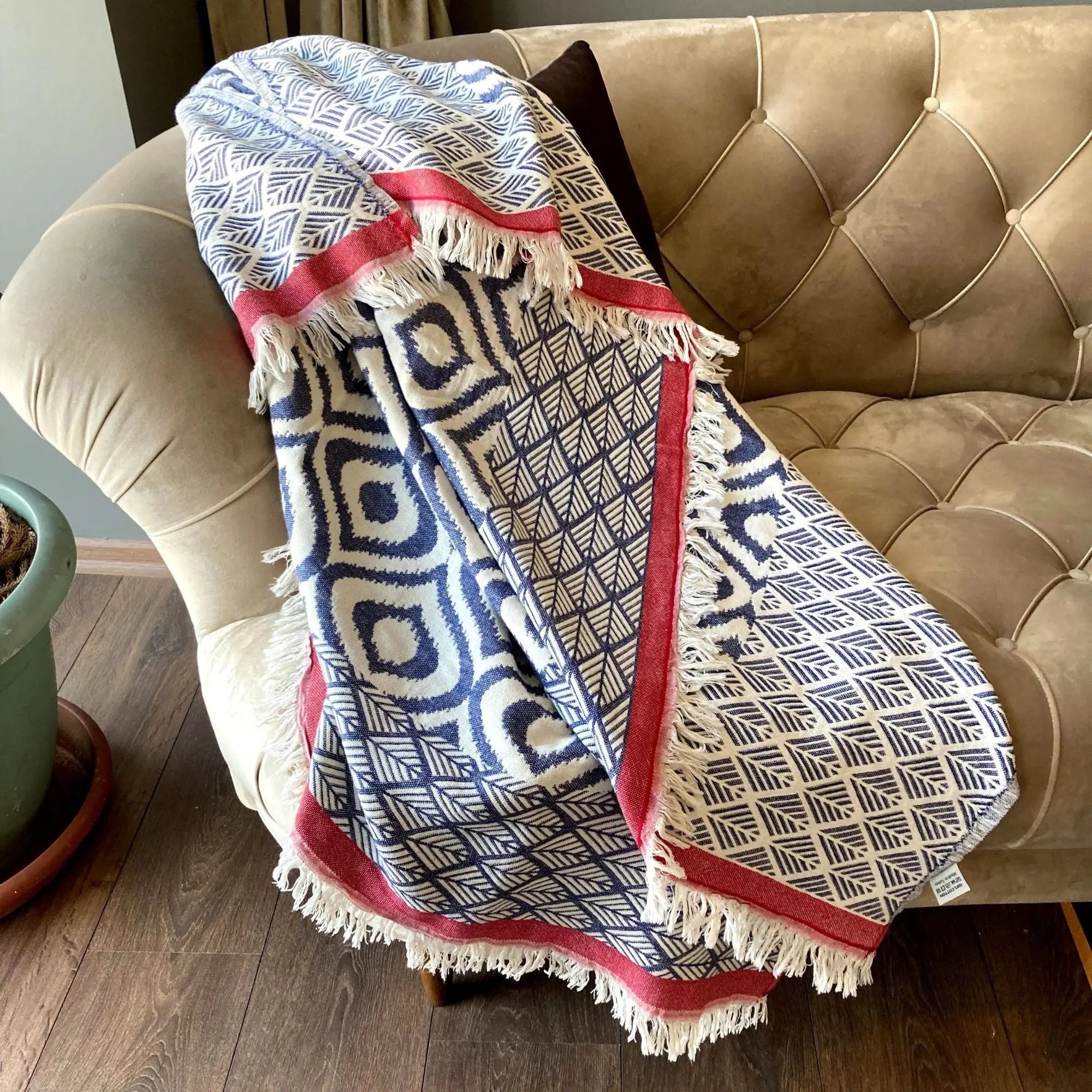 Large denim blue and red striped Turkish cotton plaid throw with geometric ikat patterns, ideal as a sustainable fair trade bed cover or sofa throw.